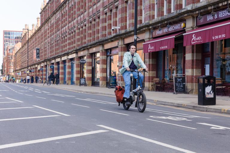 Person cycling in cycle lane urban